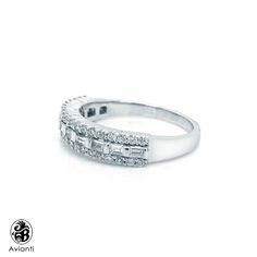 a white gold ring with three rows of diamonds on the side and an open band