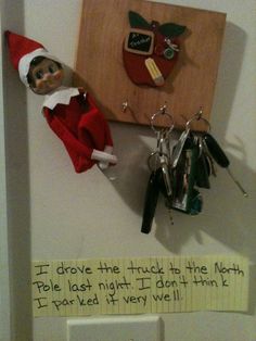 an elf is hanging on the wall with keys