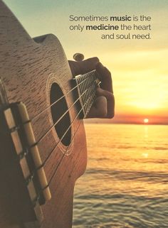 someones music is the only medicine the heart and soul need quote on an acoustic guitar