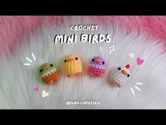 crochet mini birds are sitting on top of a fluffy white fur covered surface