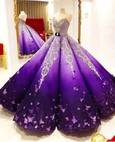 #QuinceaneraDresses #Sweet16Dress #Celebritydress #birthdaydress #laceweddingdress Sweet 15 Dresses Quinceanera Purple, Purple Plus Size Wedding Dresses, Purple Butterfly Ball Gown, Unique Purple Dress, Quinceanera Dresses Purple And Black, Purple Gold Wedding Dress, Deep Purple Quinceanera Dresses, Purple Butterfly Wedding Dress, Big Purple Dress