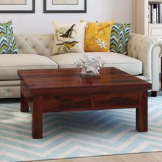 a living room filled with furniture and pillows