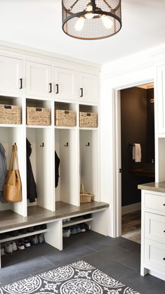 an image of a closet with baskets on the shelves