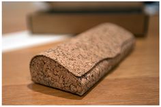 a cork case sitting on top of a wooden table