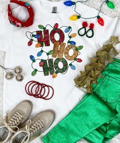 Elevate your festive style with our "Faux Sequin Ho Ho Ho Graphic Shirt." This cheerful shirt features a delightful graphic design of the words "Ho Ho Ho" adorned with a string of Christmas lights, all in faux sequins. Please note that these are graphic sequins, providing a sparkling appearance without the actual texture of real sequins.
Available in a range of styles including short sleeves, long sleeves, and sweatshirts, and spanning sizes from YXS to 5XL, this shirt offers versatility for various occasions and body types.
Perfect for holiday gatherings, spreading cheer, or just adding a touch of merriment to your everyday look, the "Faux Sequin Ho Ho Ho Graphic Shirt" captures the festive spirit with a playful and comfortable design. Embrace the holiday season in style with this sparkli Christmas Sequin Top For Festive Occasions, Sequin Top For Christmas Holiday, Festive Holiday Graphic Print Tops, Festive Holiday Graphic Print T-shirt, Holiday Graphic Print T-shirt, Fall Football, Black Friday Christmas, Rain Gear, Comfortable Design