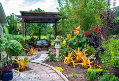 a garden with flowers and plants in it