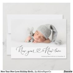 a new year's card with a baby wearing a bunny hat and holding a stuffed animal