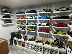 a room filled with lots of toy cars on shelves