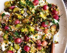 a white plate topped with broccoli, radishes and other food items