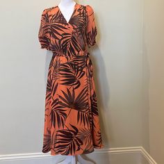 This Beautiful Midi Dress Has A Tie Sarong Waist, A Clasp For The Chest To Prevent Opening. The Shell And The Lining Are 100% Polyester. 28 Inches From Natural Waste Line. Orange Lined Midi Dress, Orange A-line Midi Dress For Vacation, Orange Tropical Print V-neck Dress, Short Sleeve Lined Midi Dress For Vacation, Vacation Short Sleeve Lined Midi Dress, Spring Orange Dress With Tie Waist, Orange Printed Midi Dress With Short Sleeves, Orange Printed Short Sleeve Midi Dress, Tropical Print Sundress With Short Sleeves