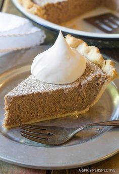 a slice of pie with whipped cream on top