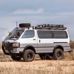 an off road vehicle parked in the middle of a field