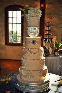 a three tiered wedding cake sitting on top of a table