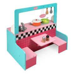 a toy kitchen with pink and blue furniture