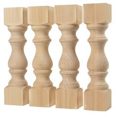 four wooden candlesticks are lined up against each other