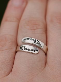 "Copy and paste into your browser, get 15% off ➔ https://bit.ly/VD15OFF Like wildflowers, you must allow yourself to grow in all the places people never thought you would. DETAILS: -Each ring is hand stamped -Ring is Aluminum or Sterling Silver -4mm in thickness You will receive one hand-stamped lavender aluminum ring filled with a black enamel finish. **Every item is handmade, this means that each will be unique and may not look EXACTLY like the picture, but it will look very similar ➡ORDER PRO Minimalist Rings As Spring Season Gifts, Minimalist Ring As Spring Gift, Minimalist Rings For Spring Gift, Minimalist Ring As Spring Season Gift, Minimalist Spring Rings For Gift, Spring Gift Open Ring, Delicate Flower Ring For Spring Gift, Delicate Spring Flower Ring Gift, Personalized Silver Adjustable Flower Ring