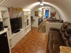 a living room filled with furniture and a flat screen tv