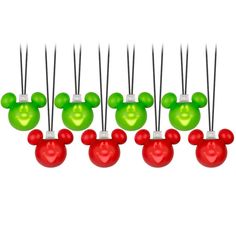 a set of six mickey mouse ornaments with green and red balls in the shape of heads