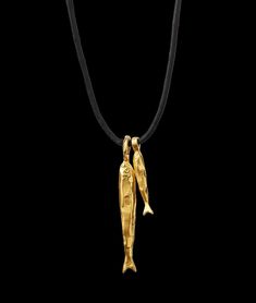 The Gone Fishing Necklace celebrates the magic of seaside adventures and the summer souvenir. A pair of molten gold fish are suspended on black Japanese cord; cast in recycled bronze and plated in Alighieri’s signature 24kt gold-plating in the UK. Carry it to bring you all good things on your adventures. Fishing Necklace, Gold Fish Necklace, Artsy Clothes, Molten Gold, Black Japanese, Japanese Jewelry, Fish Jewelry, Artsy Outfit, Metal Fish