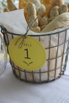 a basket filled with bread on top of a table