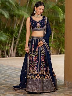 Introducing our amazing navy blue thread embroidered georgette lehenga choli, a stunning ethnic ensemble perfect for weddings, receptions, and other special occasions. This set includes a navy blue color georgette material lehenga adorned with intricate zari work, sequin work, multi-thread embroidered work, and dori work.
The matching georgette choli features the same exquisite detailing, making it a perfect complement to the lehenga. To complete the look, the set also includes a similar color g Unstitched Blue Choli With Intricate Embroidery, Blue Resham Embroidered Lehenga In Georgette, Blue Embroidered Lehenga In Georgette, Blue Choli With Intricate Embroidery, Blue Georgette Lehenga With Intricate Embroidery, Semi-stitched Blue Choli With Resham Embroidery, Embroidered Blue Georgette Lehenga, Blue Embroidered Georgette Lehenga, Semi-stitched Blue Choli With Intricate Embroidery