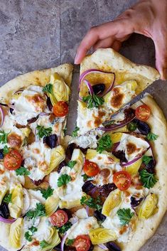 Oct 31, 2019 - This Mediterranean pizza is loaded with toppings such as artichokes, sun-dried tomatoes and olives. It's a healthy addition to your weeknight dinner plans. Best Mediterranean Recipes, Homemade Pizza Recipe Easy, Mediterranean Pizza, Vegetarian Pizza Recipe, Dinner Pizza, Mediterranean Recipes Healthy, Mediterranean Diet Recipes Dinners, Mediterranean Diet Meal Plan, Easy Mediterranean Diet Recipes