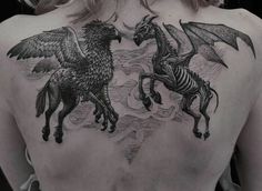 the back of a woman's chest with two horses and a skeleton on it