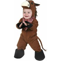 a little boy dressed in a horse costume