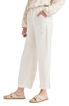 Easy does it in lightweight, linen-kissed pants designed with wide legs in a slightly cropped silhouette. 25" inseam; 20 1/2" leg opening; 9 3/4" front rise; 14" back rise (size Medium) Elastic/drawstring waist Front slant pockets; back patch pockets 73% lyocell, 27% linen Machine wash, tumble dry Imported White Flowy Pants, Easy Does It, Cropped Wide Leg Pants, Flowy Pants, Wide Leg Pant, Pants Design, White Sand, Basic Tops, Denim Pant