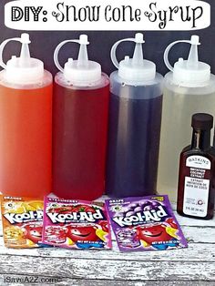 some bottles and candy are sitting on a table with the words diy snow cone syrup