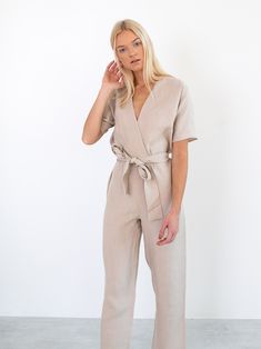 "AURORA is a short sleeve jumpsuit with belt. DETAILS - Wrap style top - Dolman sleeves - Self tie belt - 100% lightweight European linen fabric - Cut and sewn to order just for you in our studio COLOR - Beige, you can also choose other colors above - Fabric samples are available here https://www.etsy.com/listing/586569696/linen-fabric-samples SIZING & FIT - Fits true to size - Inseam is approximately 28.5 inches / 72 cm - Bust is approximately 21 inches / 49.5 cm - Waist is approximately 18 Jumpsuit With Belt, Linen Overalls, Linen Wrap Dress, Kimono Wrap Dress, Short Sleeve Jumpsuit, Womens Jumpsuits, Studio Color, Summer Linen Dresses, Linen Clothing