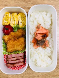 two plastic containers filled with rice, meat and veggies next to each other