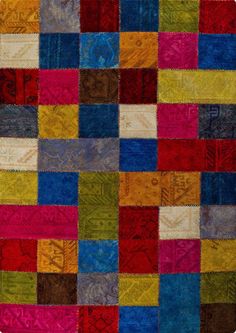 a multicolored patchwork rug is shown