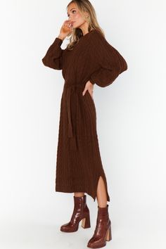 Indulge in style with our Barb Chocolate Cable Knit Sweater Dress! This midi dress boasts playful balloon sleeves and a removable tie for added flair. Keep cozy and chic at the same time. (Warning: may cause sweater dress obsession.) Cable knit sweater dress Midi length Side slits Crew neckline Balloon sleeves *Comes with a removable tie 53% Polyester | 38% Acrylic | 7% Nylon | 2% Spandex Hand wash cold. Lay flat to dry. Fits true to size. Model is wearing a size S. Brown Sweater Dress, Easy Silhouette, Cable Knit Dress, Cable Knit Sweater Dress, Warm Chocolate, Fall Fit, Fall Dress, Sport Dress, Sweater Dress Midi