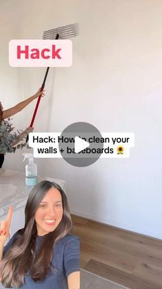 two women are sitting at a table and one is holding a broom in her hand