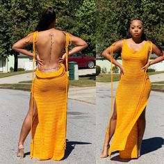 two women in yellow dresses are standing on the street with their back to the camera