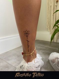 a woman's foot with a tattoo on it and the words, buddha tattoo