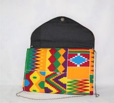 The is crossbody bag would be a great addition to your wardrobe.  Bring some African flavor into your life. Multicolor Clutch Box Bag For Everyday Use, Multicolor Clutch Box Bag, Multicolor Crossbody Clutch For Daily Use, Multicolor Envelope Bag For Everyday Use, Multicolor Travel Shoulder Bag With Chain Strap, Multicolor Shoulder Bag With Chain Strap As Gift, Everyday Multicolor Clutch Shoulder Bag, Multicolor Clutch Bags With Cell Phone Pocket, Multicolor Crossbody Flap Bag