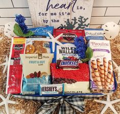 a gift basket filled with snacks and treats for someone's special occasion to share