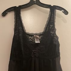 Black Nighty With Pleated Detail At Back And Front And Lace Top. Ties At Back. So Pretty. Pictures Don’t Do It Justice. New Without Tags Black Sleep Top With Built-in Bra, Black Sleeveless Sleepwear With Lace Trim, Black Cami Sleepwear With Lace Trim, Black Lace Trim Cami Sleepwear, Black Camisole Nightgown, Sheer Black Sleeveless Sleepwear, Black Lace Trim Sleep Top, Black Sheer Sleeveless Sleepwear, Black Cami Sleepwear For Lounging