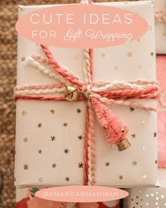 a gift wrapped in white paper with pink and gold stars on it, the words cute ideas for gift wrapping