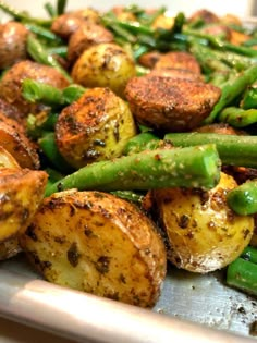 some green beans and potatoes in a pan