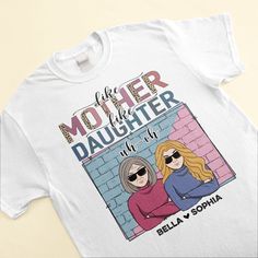 a white t - shirt with two women wearing sunglasses and the words mother daughter on it