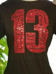 a t - shirt with the number thirteen written on it