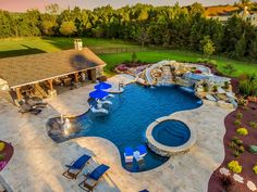 an aerial view of a backyard with a swimming pool