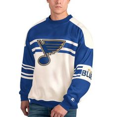 The Men's Starter White St. Louis Blues Defense Fleece Crewneck Pullover Sweatshirt is the perfect way to show unwavering support for the St. Louis Blues. Crafted from a cozy cotton and polyester blend, this midweight sweatshirt features embroidered fabric applique and graphics that proudly display allegiance to the Blues. The fleece lining provides added warmth during chilly game days, while screen-printed stripes add a stylish touch. Whether cheering from the stands or showing support, this sw Sportswear Long Sleeve Fan Gear Sweatshirt, Fan Gear Sportswear Sweatshirt, Sportswear Long Sleeve Sweatshirt For Fan Gear, Sports Fan Apparel Sweater With Long Sleeves, Sports Fan Apparel Long Sleeve Sweater, Blue Long Sleeve Sweatshirt For Fan Gear, Blue Long Sleeve Sweatshirt For Fans, Winter Sports Fleece Tops, Winter Fleece Tops For Sports Events