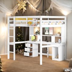 a white loft bed with desk underneath it and christmas decorations on the wall behind it