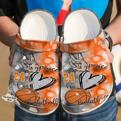 Get your product: Basketball Personalized Peace Love Crocs Classic Clogs Shoes
1. PRODUCT INFORMATION:

Incredibly light and fun to wear.
Water-friendly and buoyant; weighs only ounces.
Ventilation ports add breathability and help shed water and debris.
Easy to clean and quick to dry.
Upper: Croslite.
Lining: Croslite.
Sole: Croslite.
2. SIZE CHART:
3. RETURN:
We will gladly issue you a replacement item or issue a refund back to your original form of payment for any of the following reasons:
You Basketball Crocs, Crocs Clog, Personalized Basketball, Clog Shoes, Crocs Classic Clogs, Shoes Basketball, Wooden Shoes, Unique Christmas Gifts, Crocs Shoes