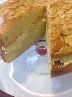 a cake on a plate with one slice cut out