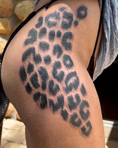 a woman's thigh with an animal print on it